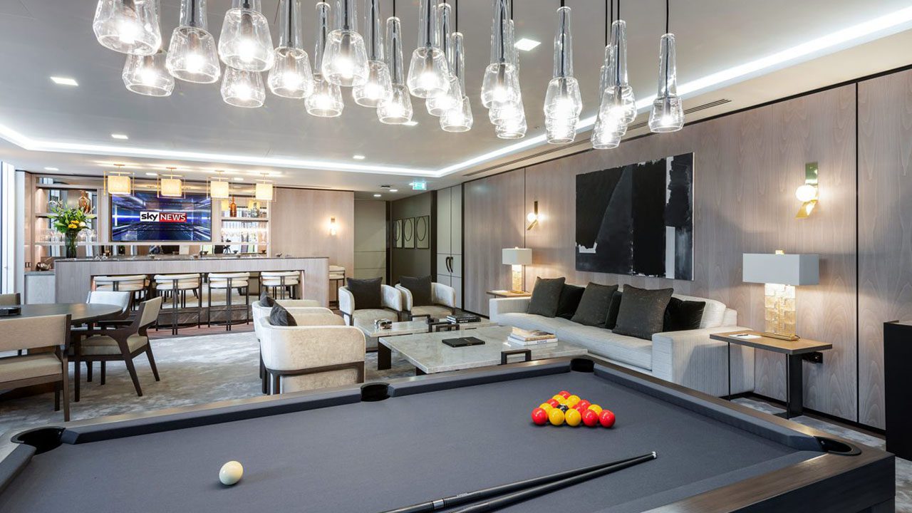 Games room and chill-out area with comfortable seating and ambient lighting