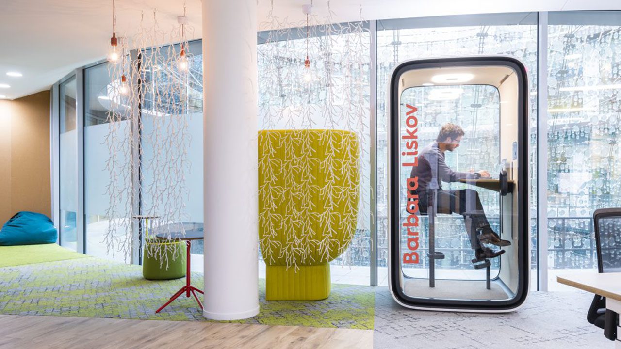 Breakout area featuring private focus pods and enclosed phone booths