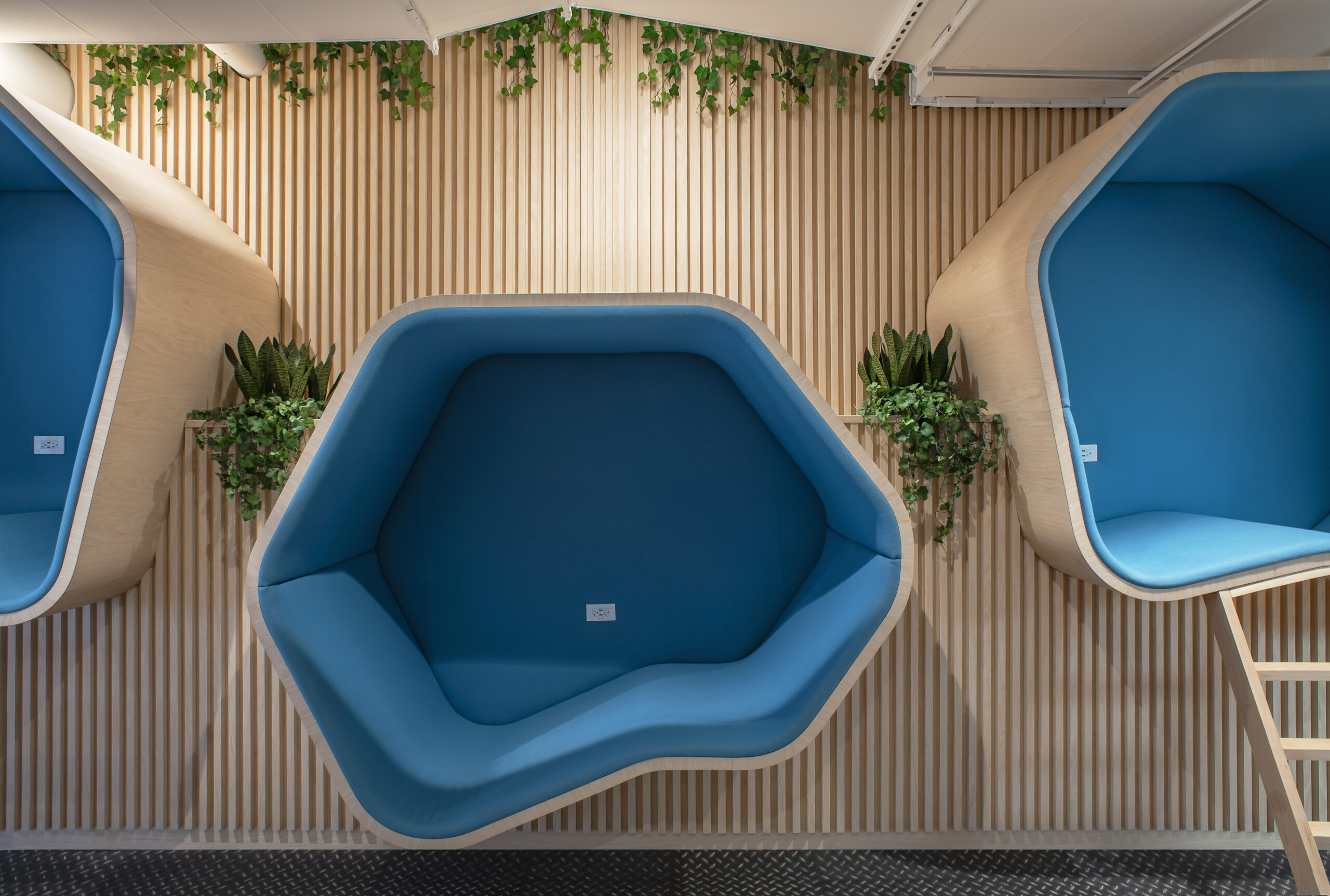 Open treehouse-style pods creating playful, restorative corners