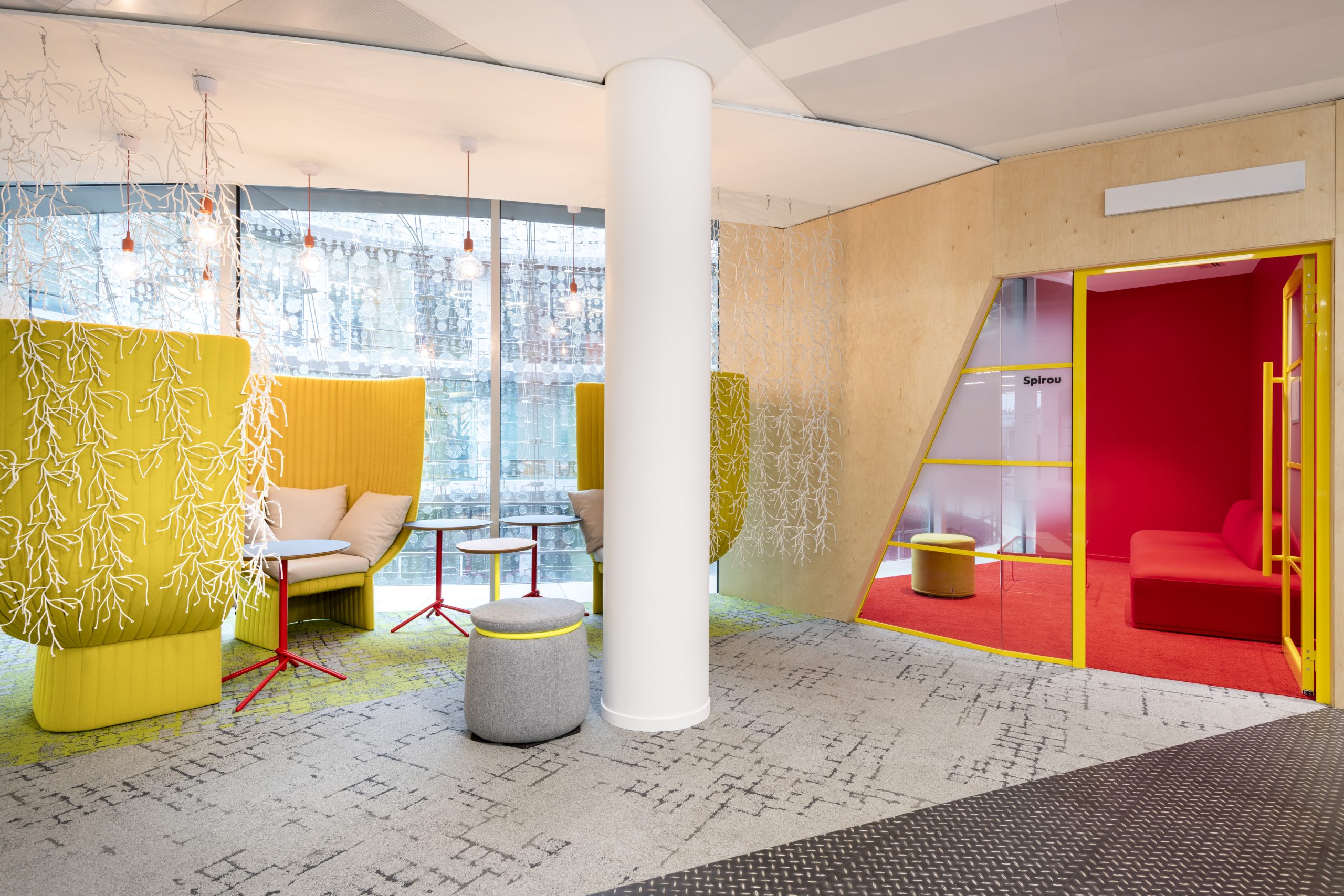 Bright open plan office with minimal partitions and greenery