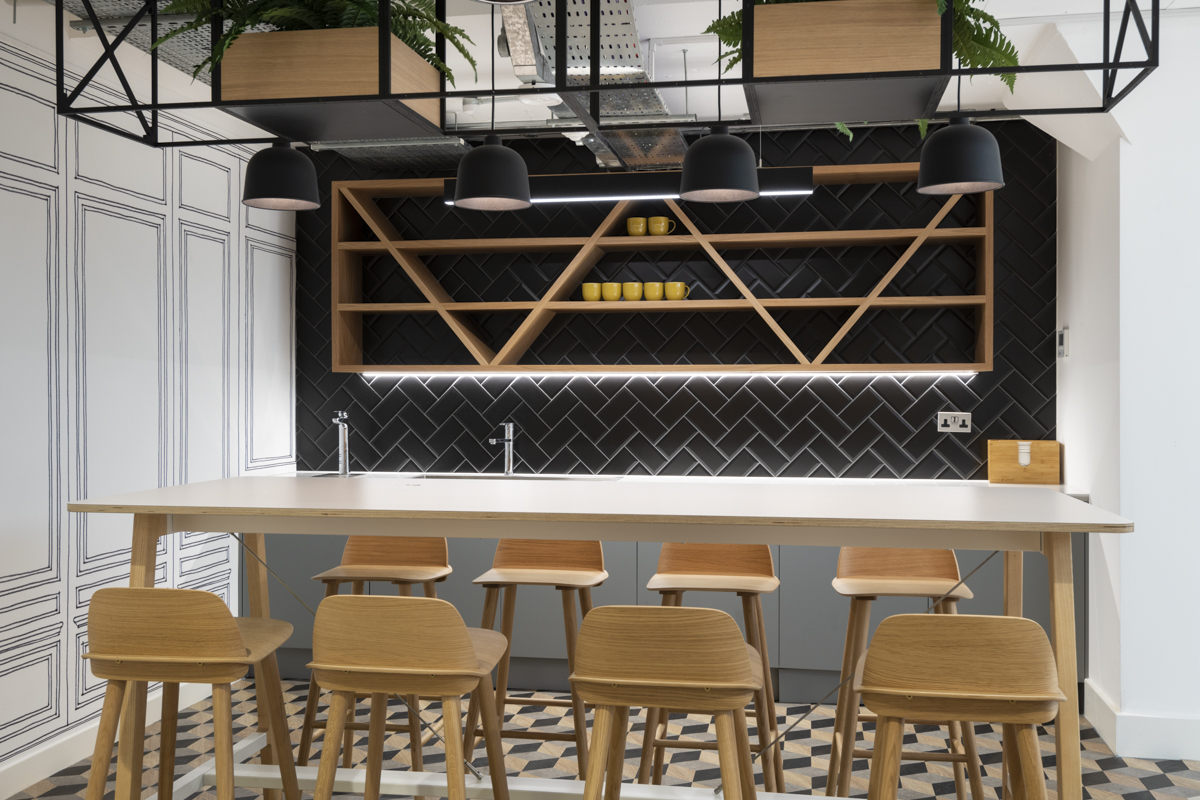 Office with acoustic ceiling panels and soft furnishings