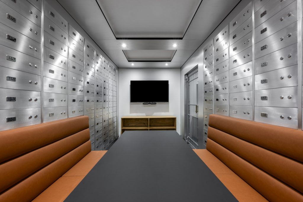 Meeting room in a converted bank vault, lined with safety-deposit boxes